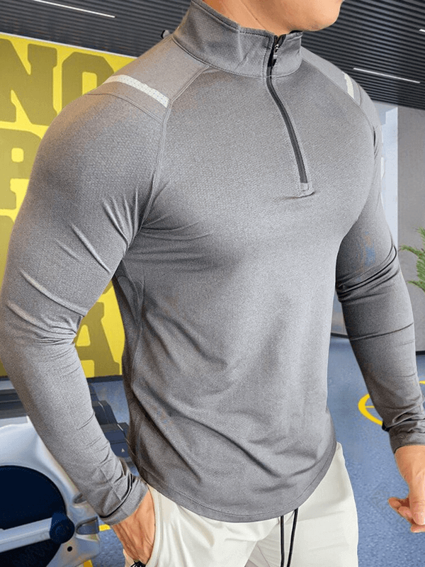 Stylish gray long-sleeve men's sports top with zipper, featuring slim fit microfiber fabric, perfect for modern activewear fashion.